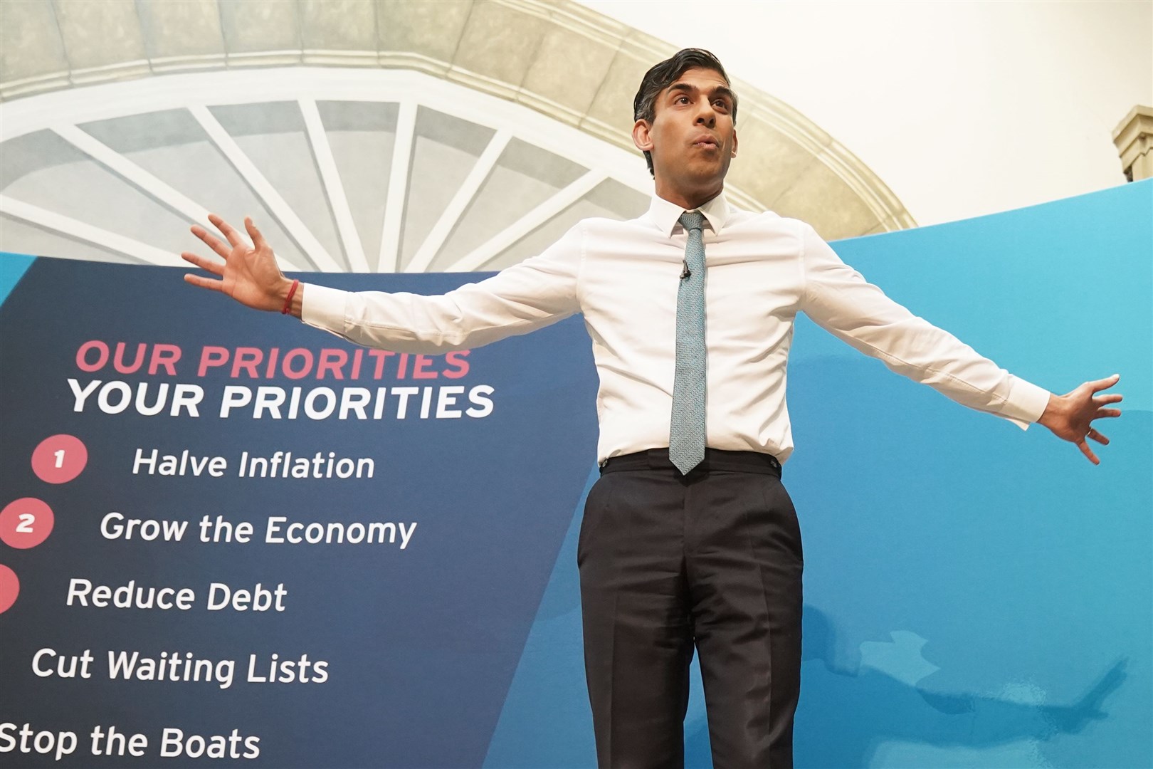 Rishi Sunak’s priorities have consistently appeared behind him as he travels the country (Owen Humphreys/PA)