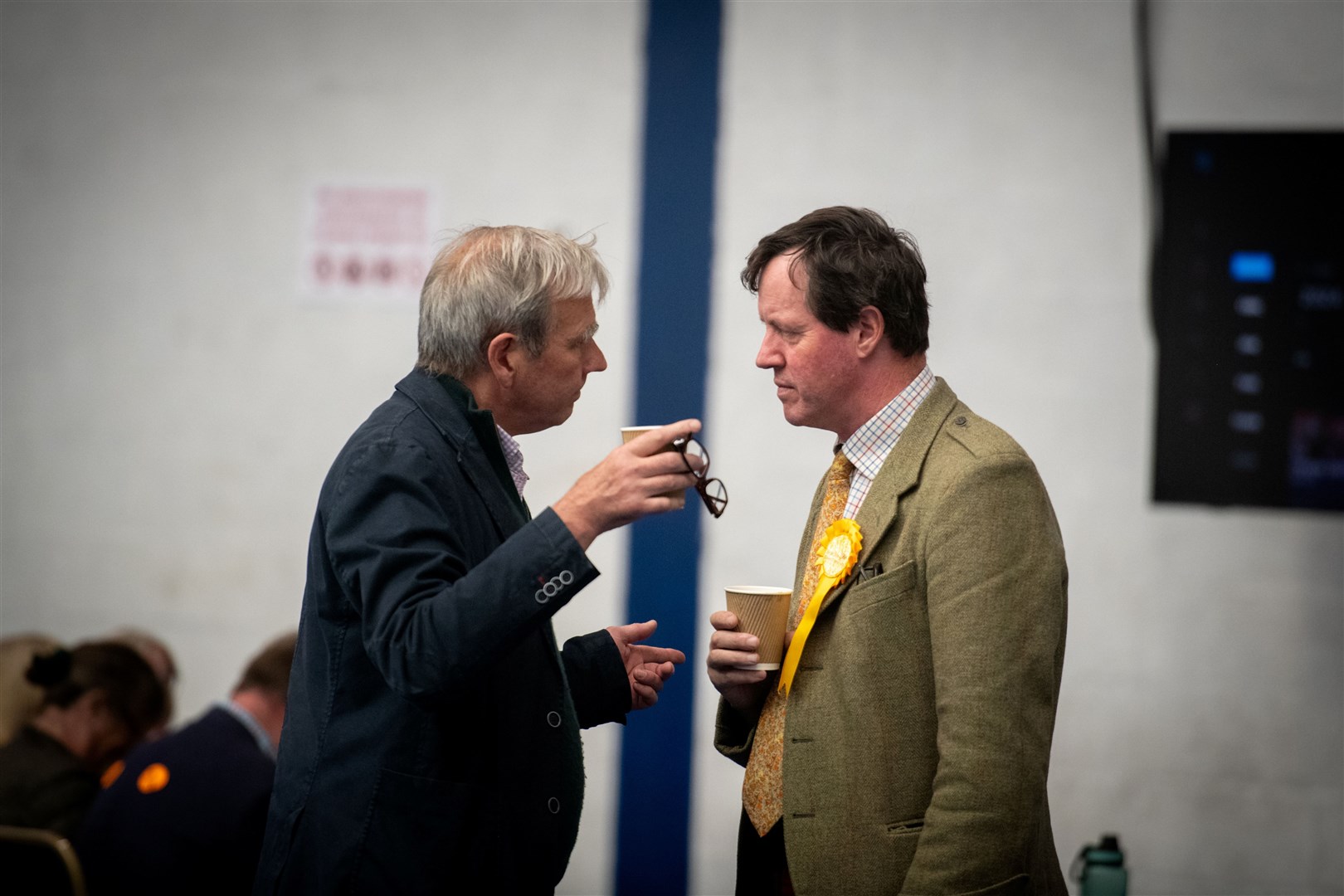 Angus MacDonald (right) confers with his election agent about the result. Picture: Callum Mackay.