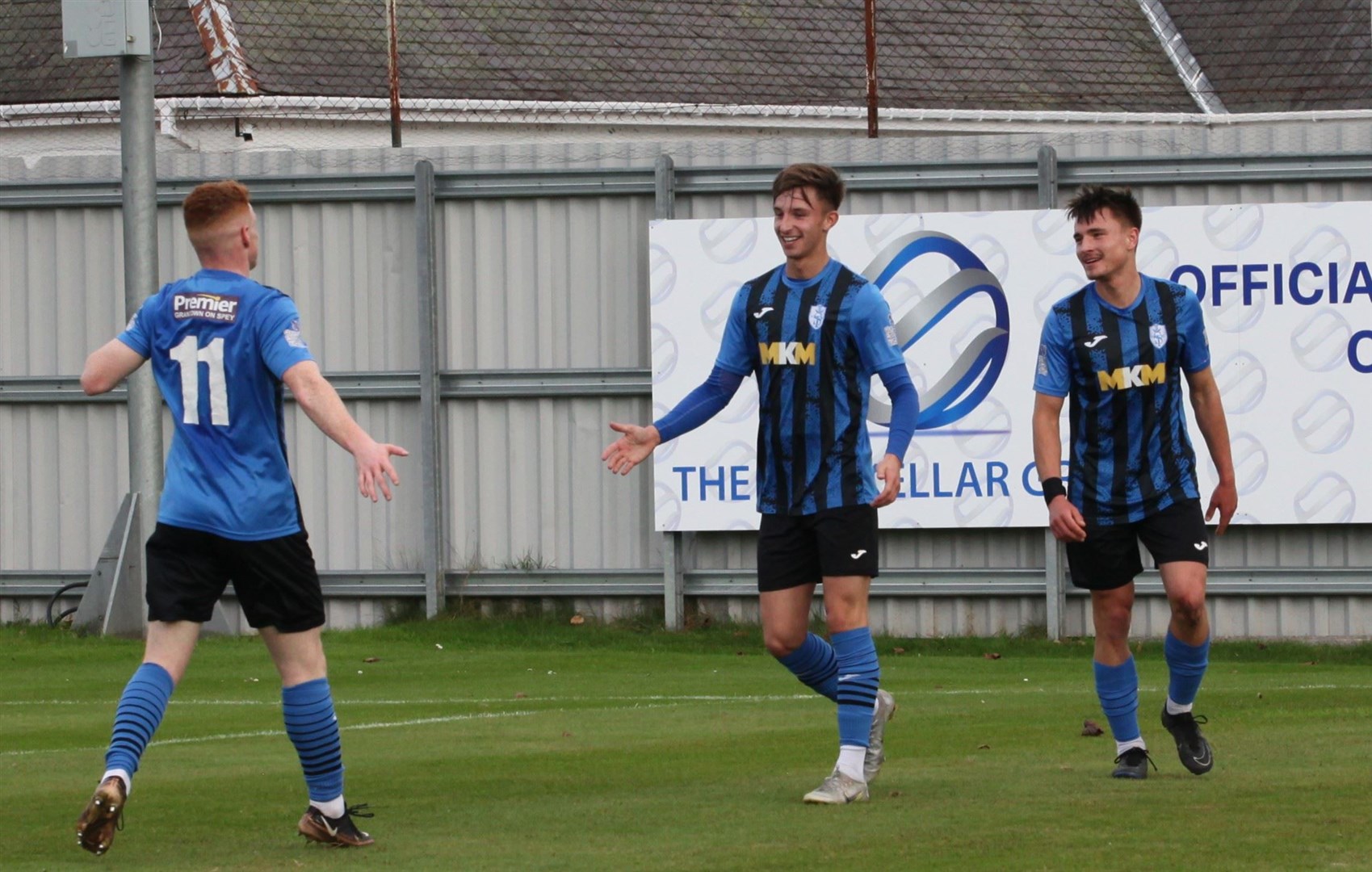 Kieran Duffty is congratulated on his goal by Caelan Mutch and Filip Franczak.