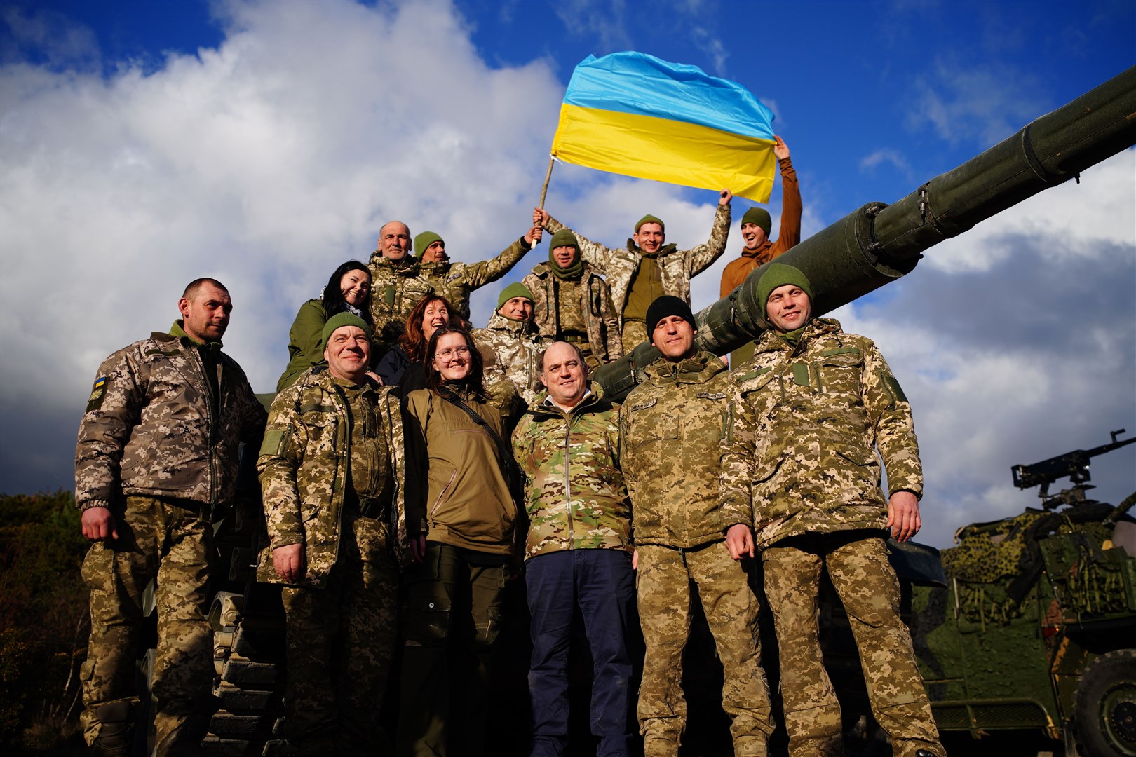 Defence Secretary Ben Wallace, centre right, with Ukrainian soldiers during a visit to Bovington Camp where they are training on Challenger 2 tanks (Ben Birchall/PA)