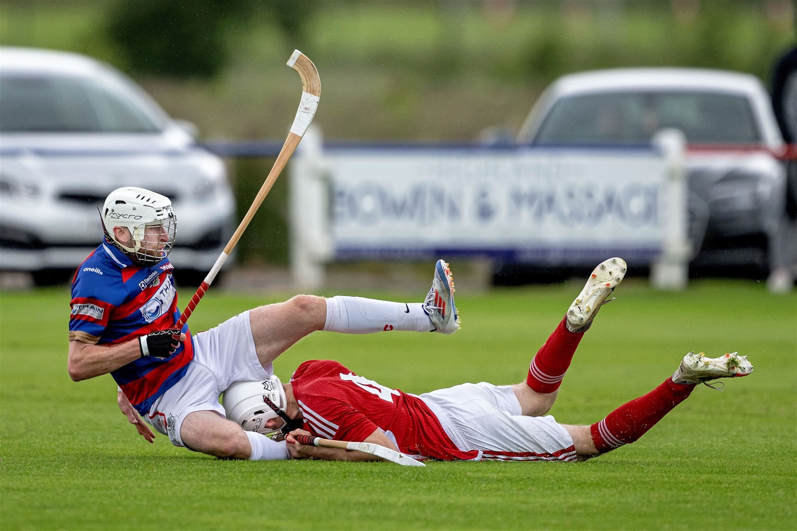 Kingussie's Ruaridh Anderson (left) blocked by Duncan WD MacRae (Kinlochshiel) in the head to head - or thereabouts - of the Artemis MacAulay Cup quarter final played at The Dell, Kingussie. Picture: Neil Paterson.