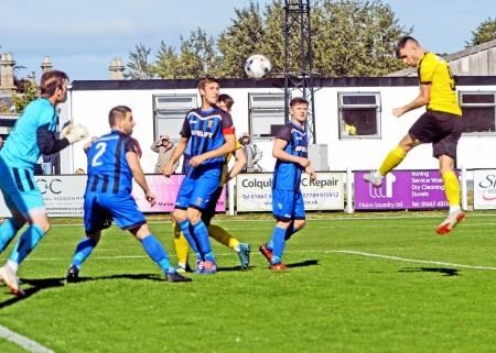 Dylan Mackenzie rises highest at a corner to head in Nairn County’s opening goal against Huntly. Picture: Gair Fraser.