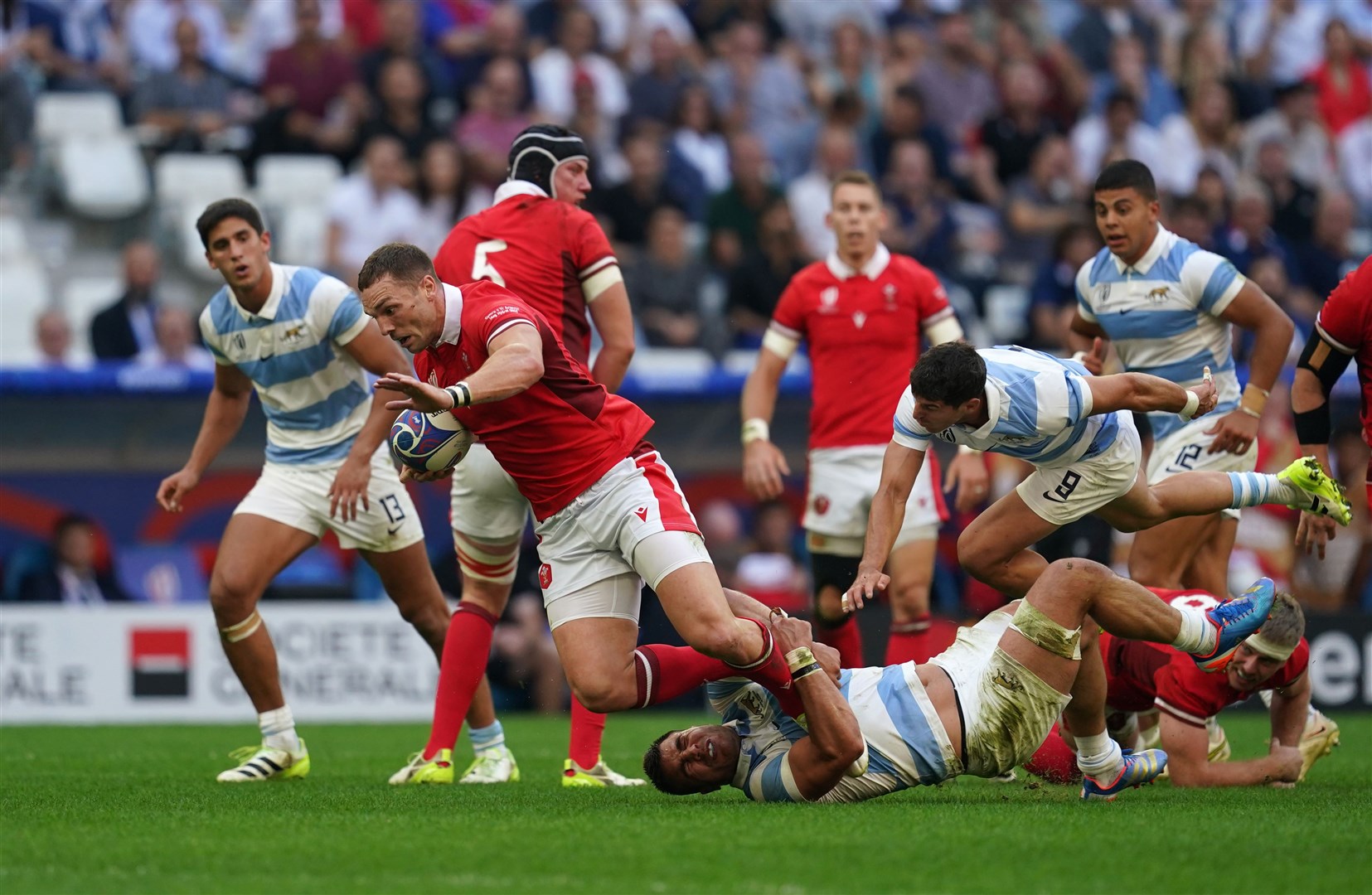 Wales’ George North is tackled during the Rugby World Cup 2023 quarter final match at Stade de Marseille (David Davies/PA)