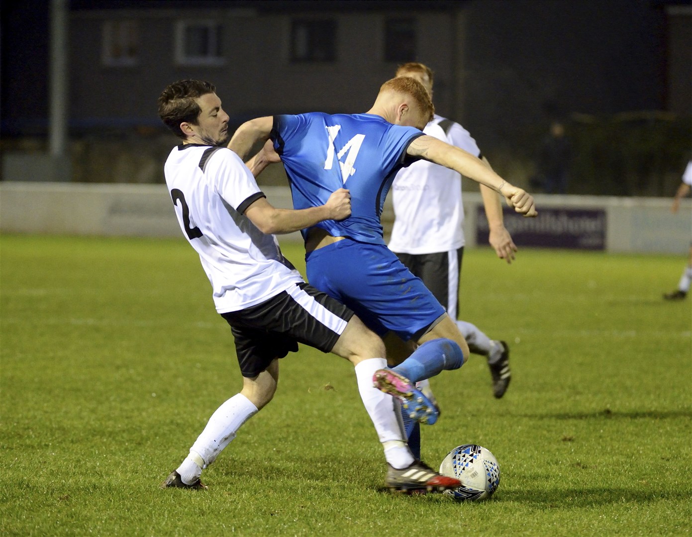 Clach's Ryan Mackintosh gets hold of Jags player Scott Morrison.