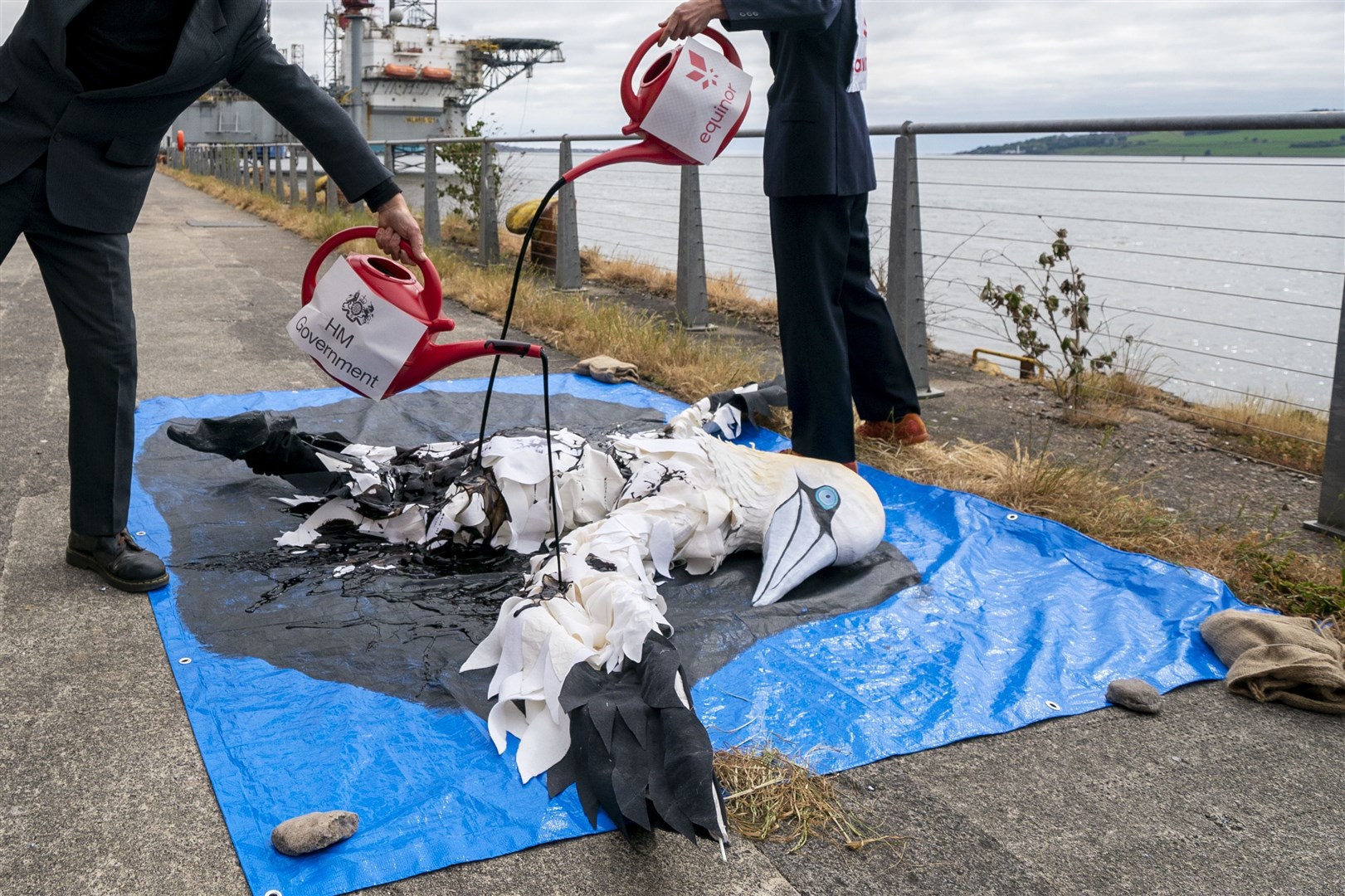 Protesters covered the giant gannet in fake oil (Jane Barlow/PA)