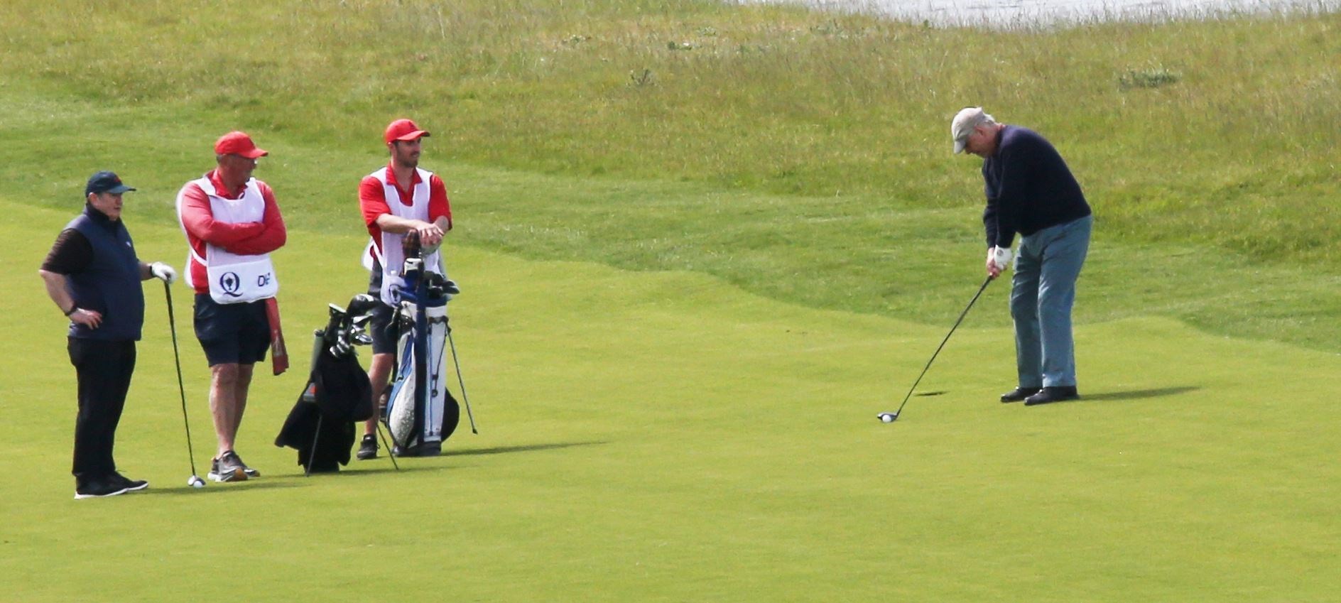 Prince Andrew about to play an approach shot at Castle Stuart.