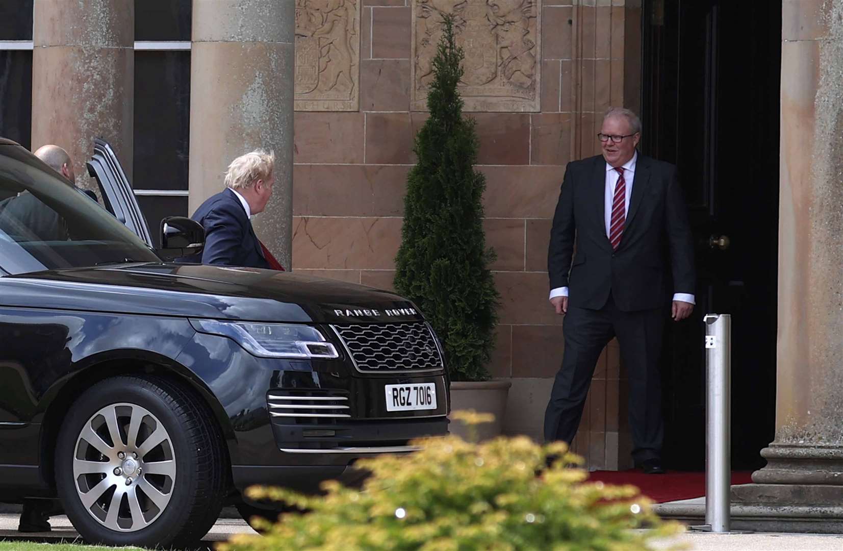 Prime Minister Boris Johnson (centre left) arrives at Hillsborough Castle during a visit to Northern Ireland for talks with Stormont parties. (Liam McBurney/PA)