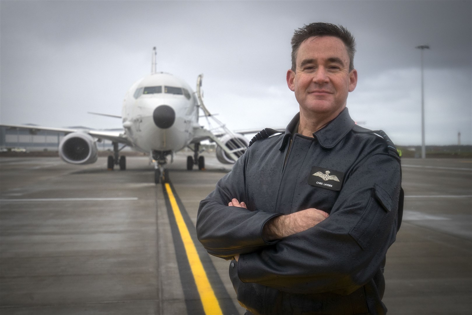 Group Captain Chris Layden, station commander, in front of the Poseidon MRA1 plane, at RAF Lossiemouth, Moray (Jane Barlow/PA)