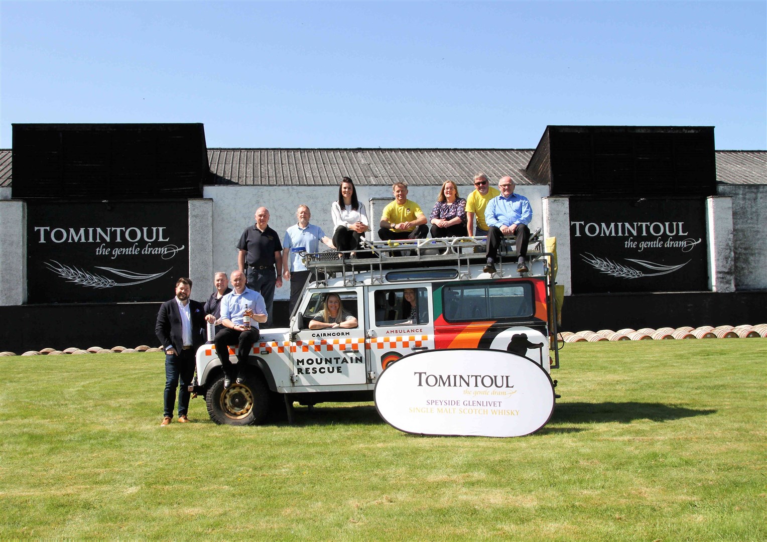 Tomintoul Distillery staff with one of the rescue team's response vehicles.