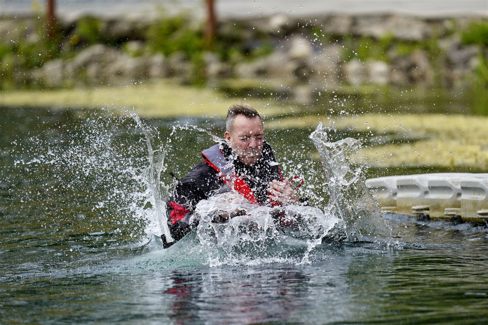 A pilot plunges into the water at Andark Lake in Hampshire during training for the Greenland Air Trophy 2021 next month (Steve Parsons/PA)