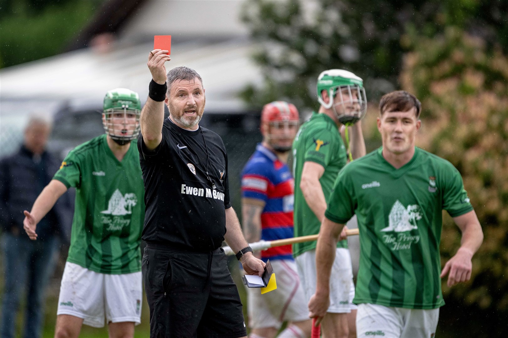 Referee Jamie Macpherson sends off Beauly's Ryan Mackay (right) for a second bookable offence in the Tulloch Homes Camanachd Cup quarter final played at Braeview.