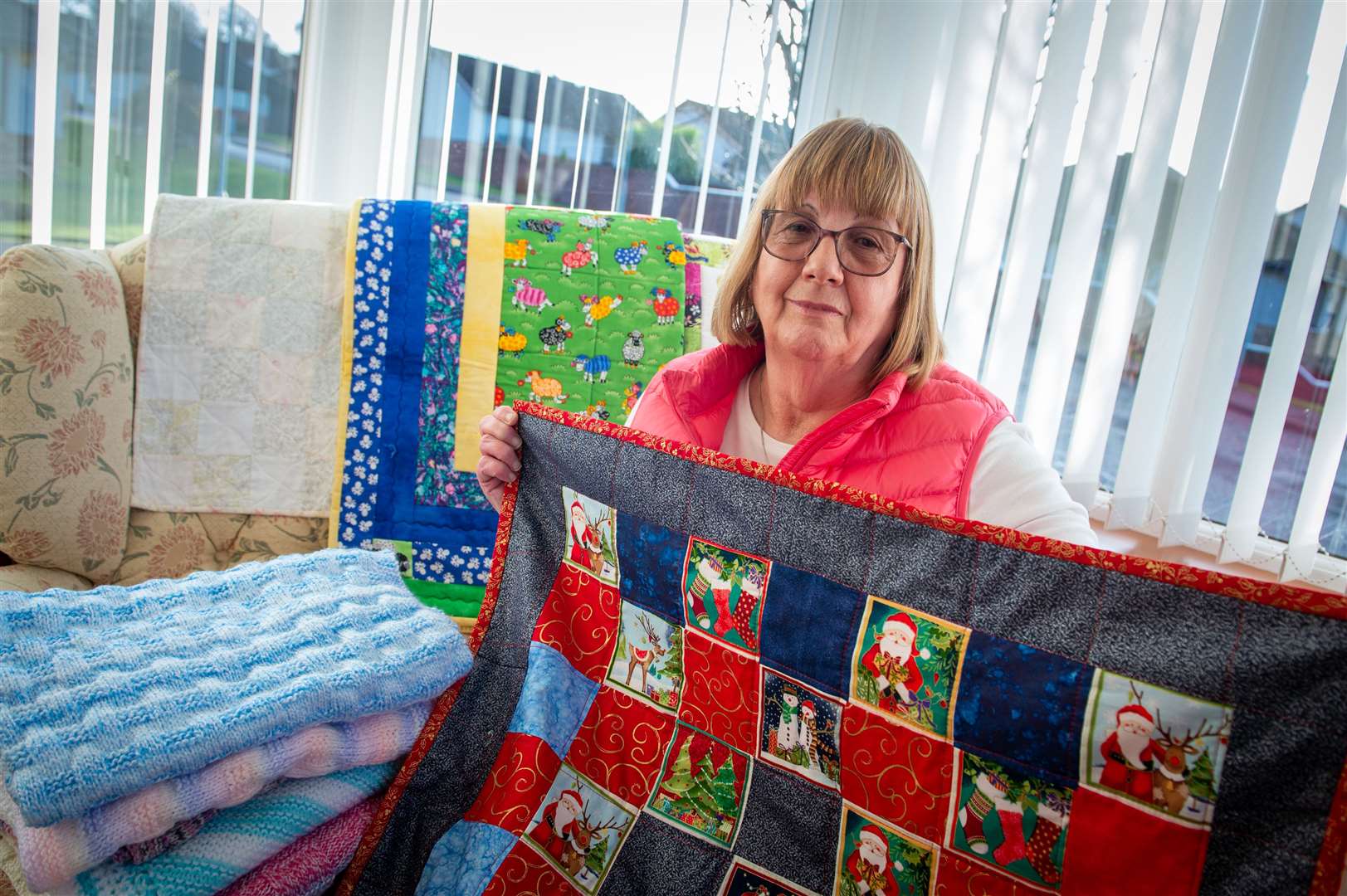 Alice Nicoll, of Project Linus, with quilts that are sent over and then go to Raigmore Hospital and other charities for those in need. Picture: Callum Mackay