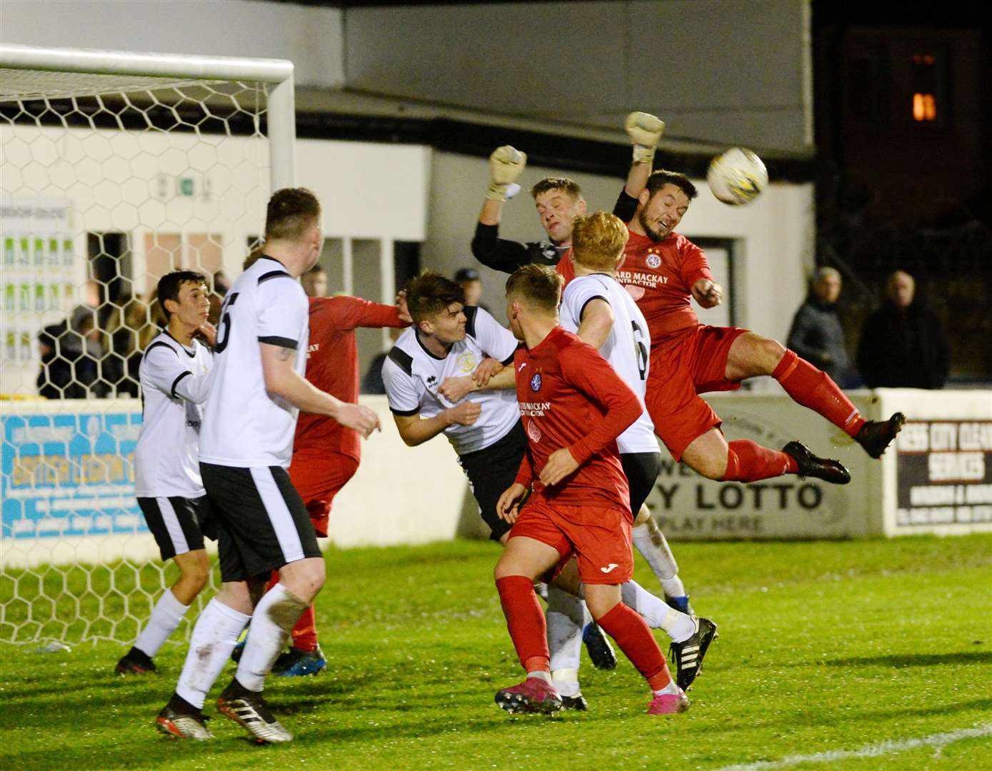 Keeper Ryan Hunter in the thick of the action whilst playing for Clach against Brora. Picture: Gary Anthony.