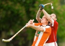 Willie Gilles (Taynuilt) and Callum McLeod (Inverness) challenge for an aerial ball during the Camanachd Cup tie at the Bught.