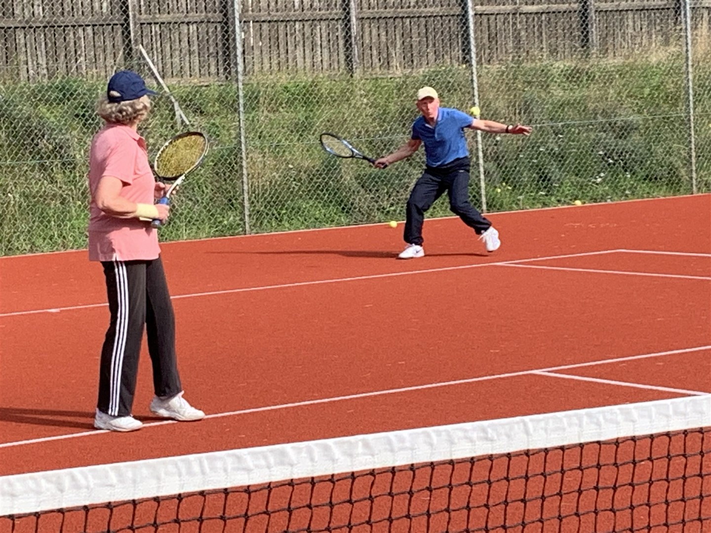 George Jachacy and wife Judith in action in the plate mixed doubles final.