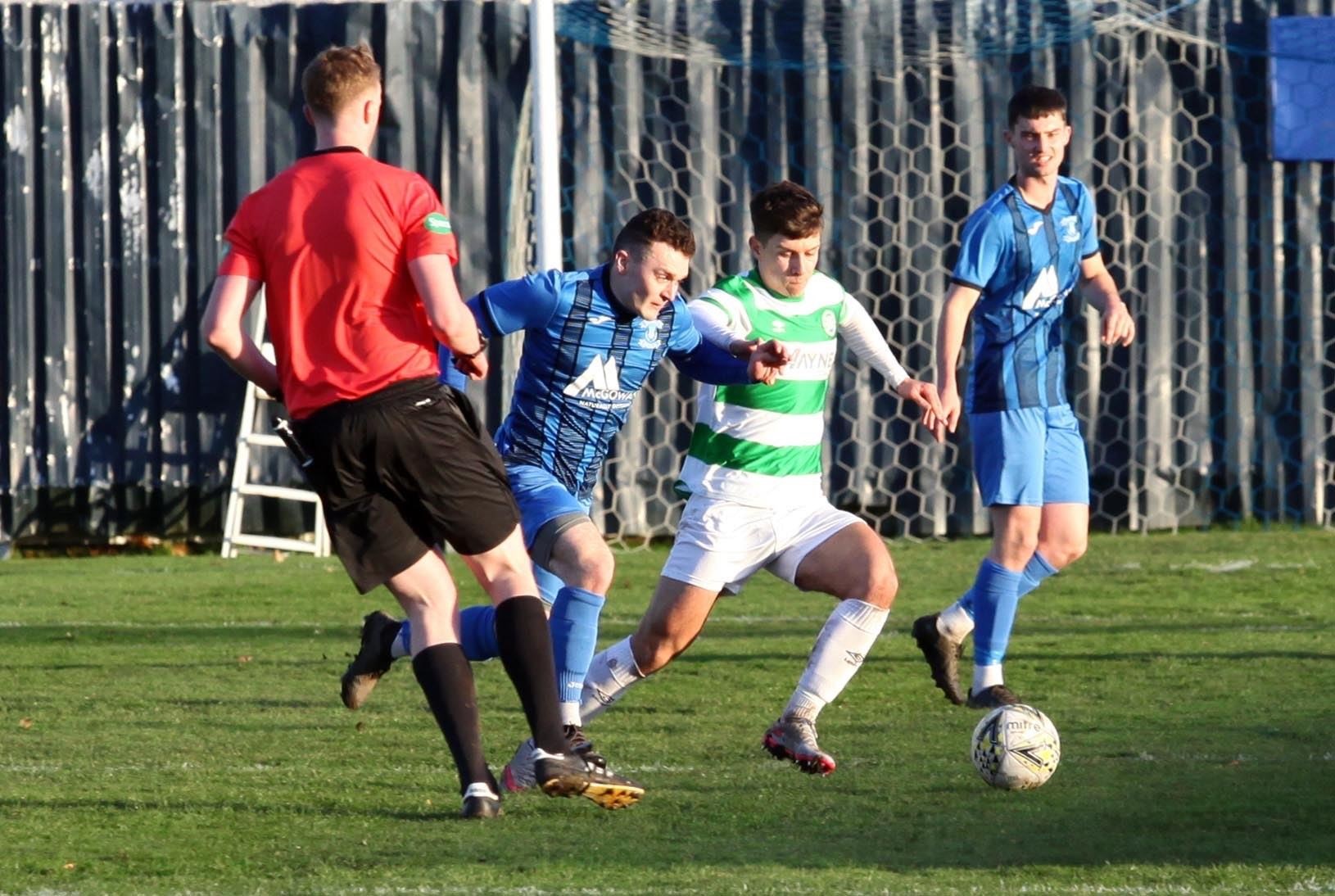 The Jags’ Kieran Chalmers in a race for the ball with Buckie’s Max Barry. Picture: Frances Porter