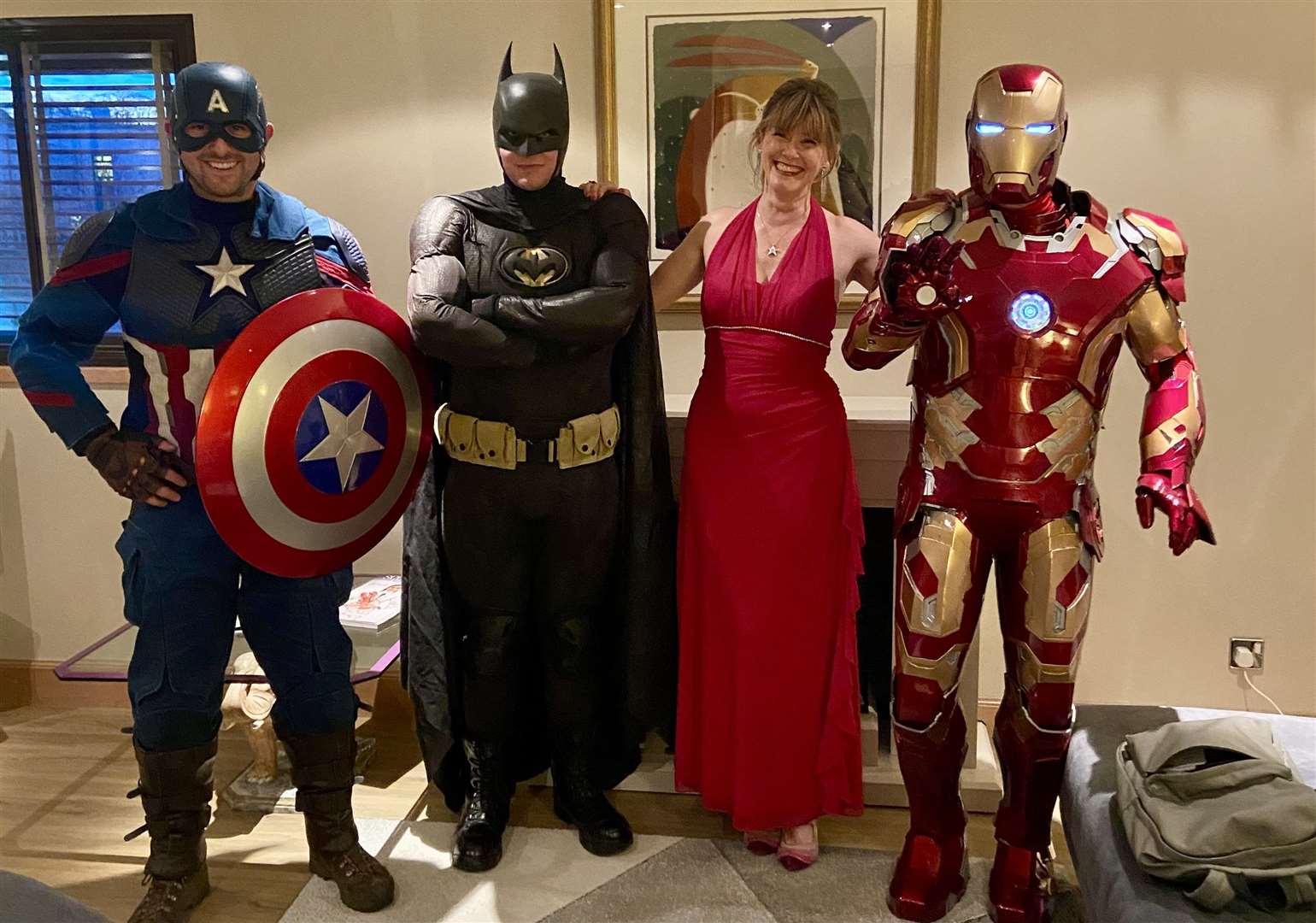 Nicky Marr with a trio of superheroes.