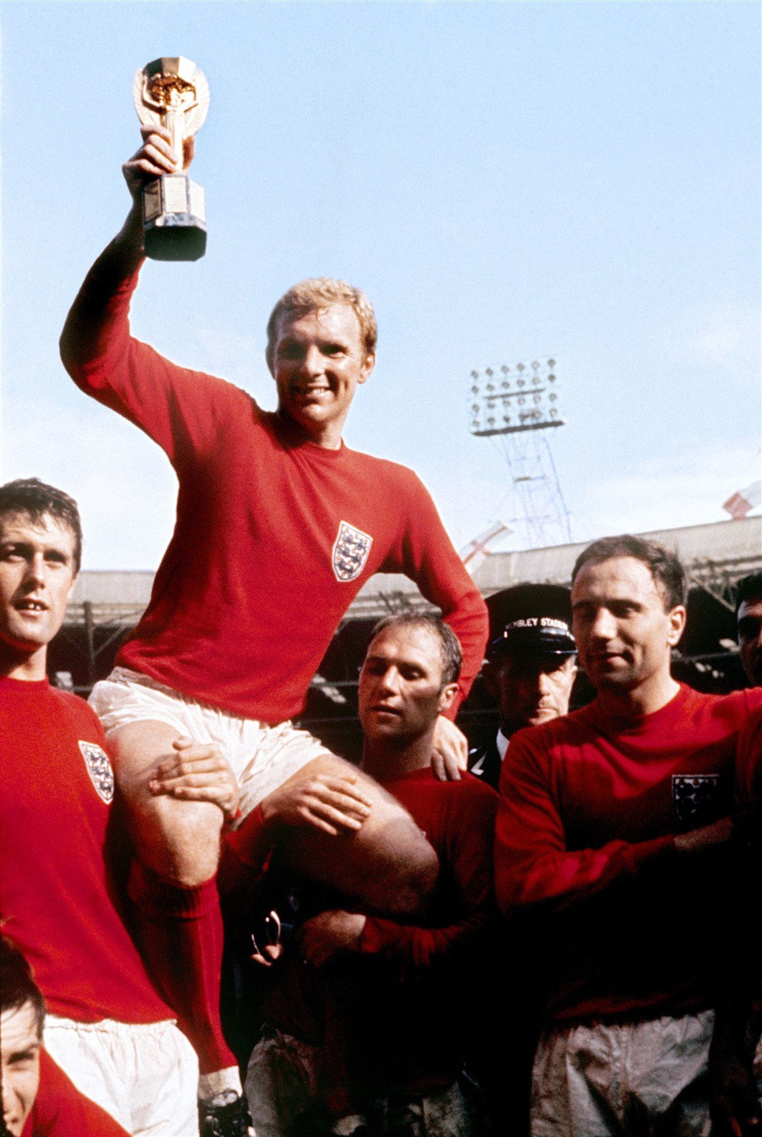 England captain Bobby Moore with the World Cup trophy after England 4-2 win against West Germany in 1966 (PA)