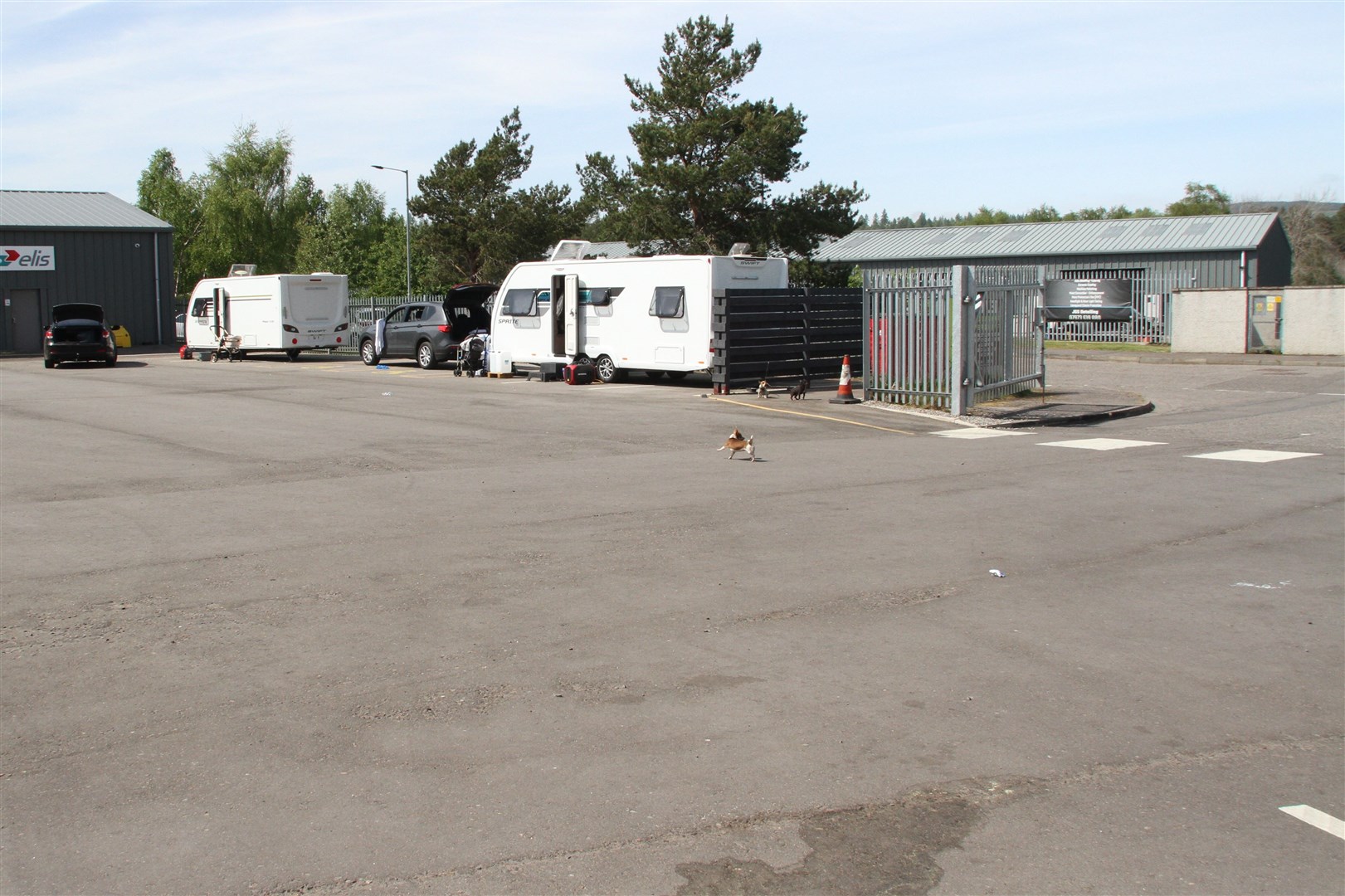 TEMPORARY STAY: Two of the vans before moving off on Wednesday