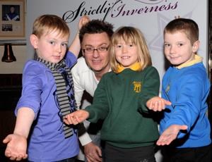 Young Strictly Inverness 2011 hopefuls (from left) Aidan Waite (9) from Cawdor; Abi Smith (6) from Allanfearn; and Tai Wilson (9) from Raigmore, with instuctor Tristain Hill. Picture: Gary Anthony