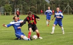 Fraser Munro gets in a sliding tackle as Joe Hardie and Matteus Bobrowski look on during Saturday’s game at Seafield Park.