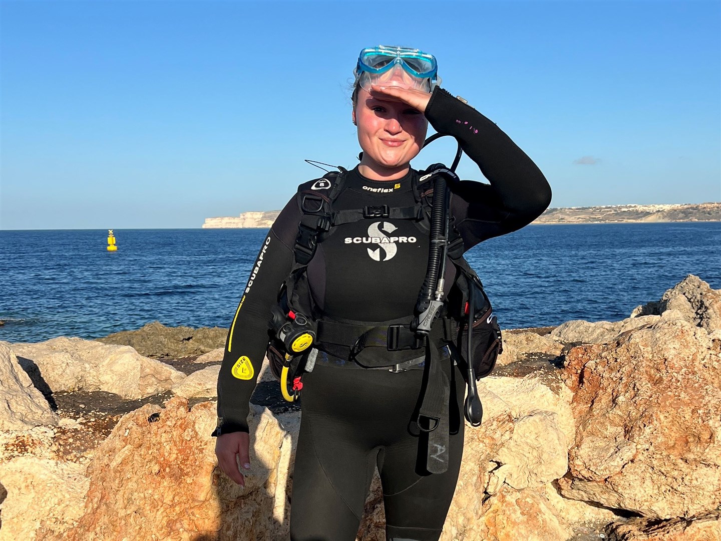 Megan Carr scuba diving in Malta while she had cancer just three days before her first surgery