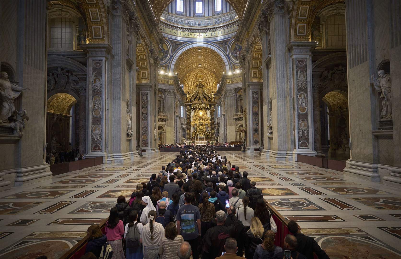People line up as they enter St Peter’s Basilica to pay their respects to Pope Francis (Emilio Morenatti/AP)