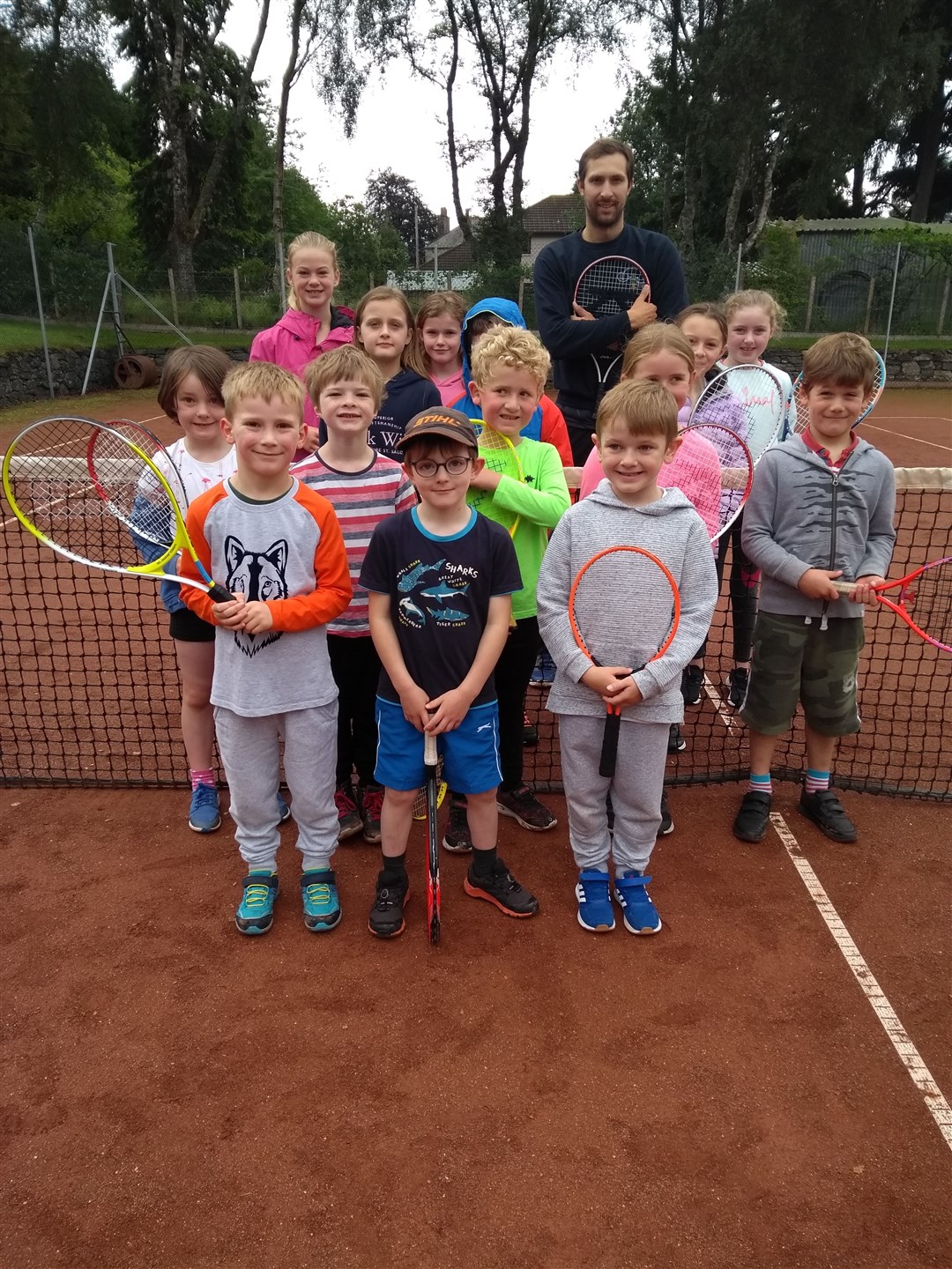 Coach Stephen Anniss with some of the young particpants in last week's summer camp at Kingussie Tennis Club.