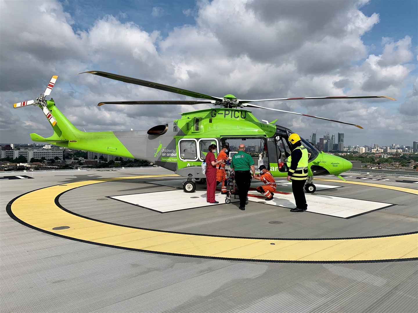 Getting Evelyn on board ahead of take-off from London for onwards bound flight to Raigmore Hospital in Inverness.
