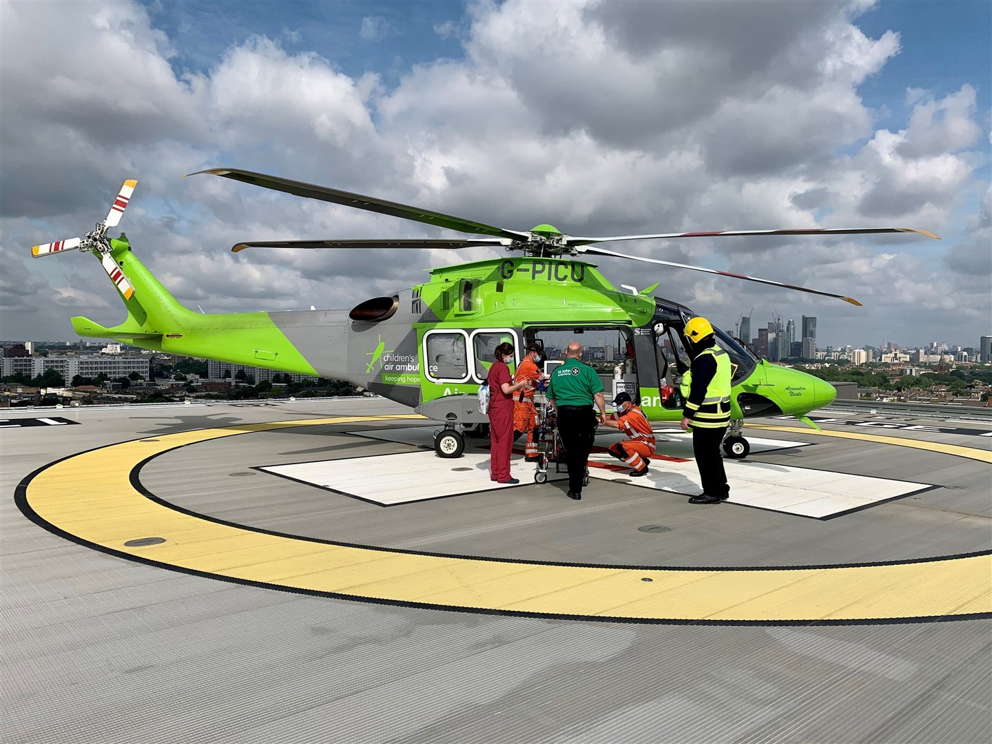 Getting Evelyn on board ahead of take-off from London for onwards bound flight to Raigmore Hospital in Inverness.