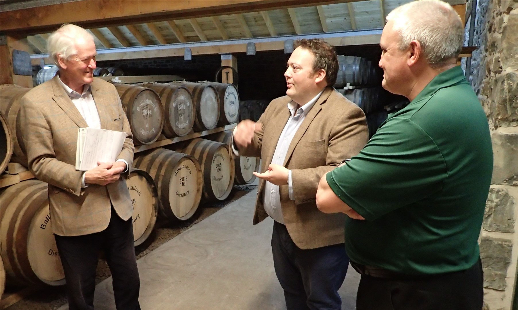 Mr Halcro Johnston (centre) talks with members of the team at Ballindalloch Distillery