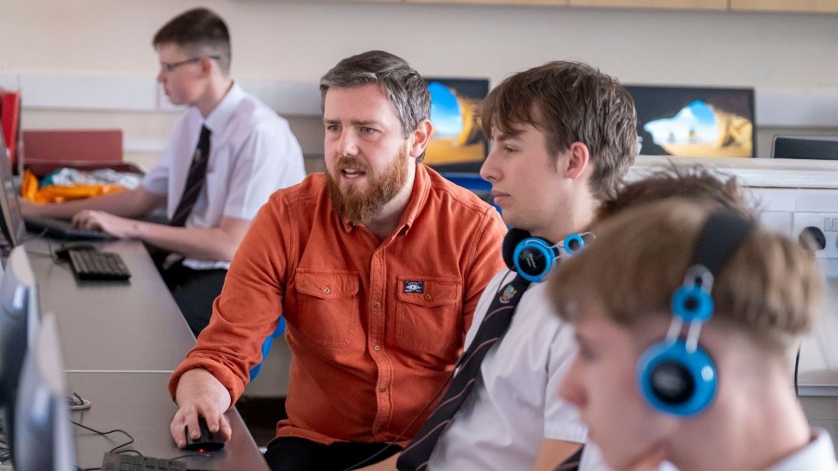 GAME ON: Teacher Steve Bailey-Young at work with the Kingussie High School students getting serious about computer games.