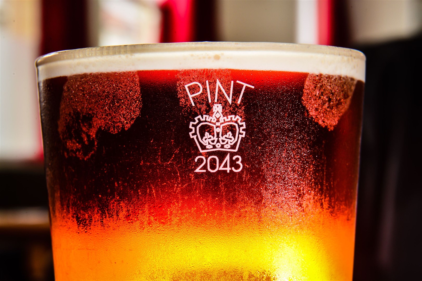 A pint glass etched with the Crown stamp rather than the European CE marking (Ben Birchall/PA)