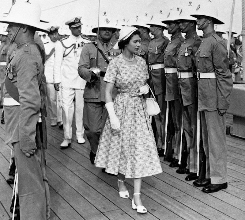 The Queen inspecting the Royal Marines Guard of Honour aboard the escorting cruiser HMS Sheffield in 1953 (PA)