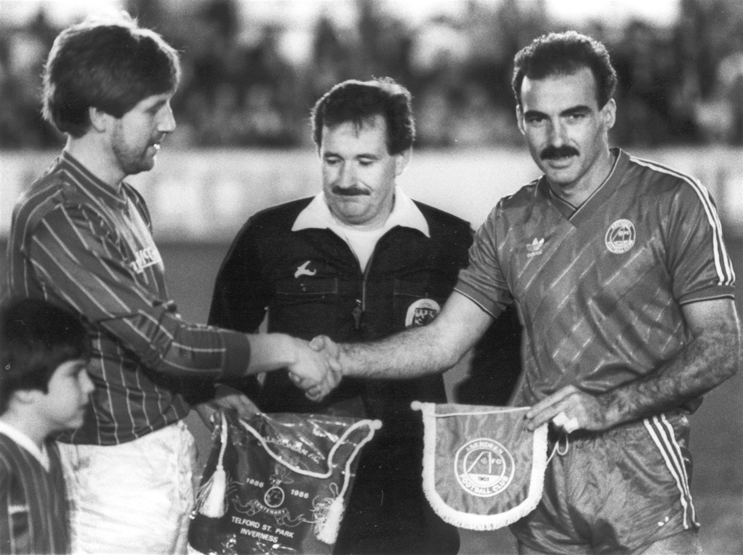 Bob Summers of Caley and Willie Miller of Aberdeen swap pennants at the start of the centenary match in November 1986. Aberdeen won 5-1 in what was their final match under Alex Ferguson.