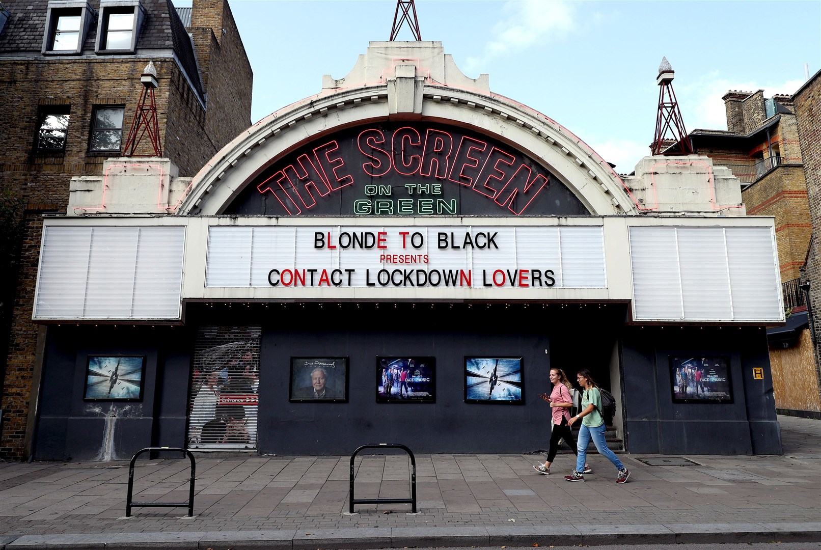 The services sector, which includes cinemas, restaurants and pubs, is growing but restrictions are slowing progress (Yui Mok/PA)