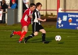 Richard Macadie takes the ball past Gary Kerr of Brora during Academy's 3-2 derby victory at Dudgeon Park on Wednesday night. Macadie got Academy's third goal, equalling Martin Gunn's club record tally with both players now having scored 64 times in the H