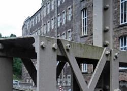 The walls of the mill race at New Lanark have been continually updated but the original design still retains both its effectiveness and its attractiveness.