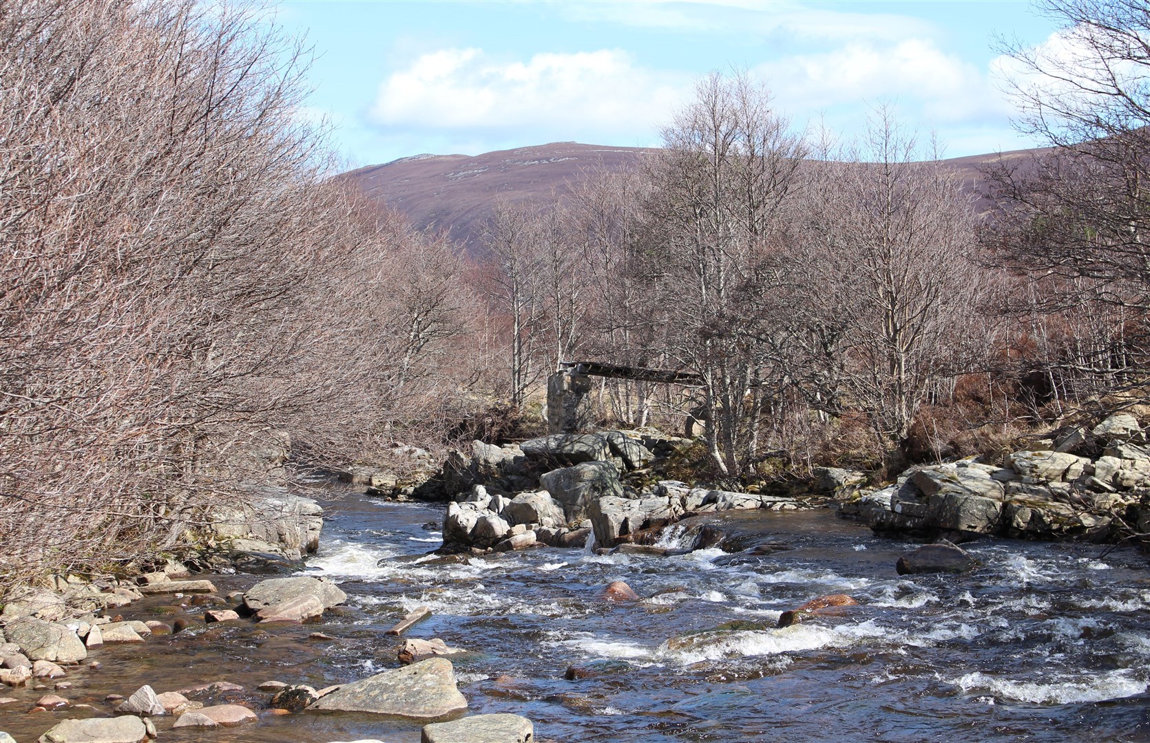 The ruined bridge over the River Tromie.
