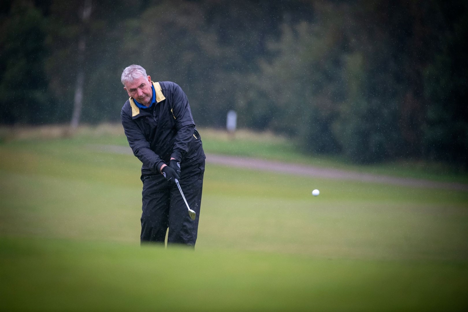 Chipping onto the green at the Tartan Tour pro-am on Monday. Pictures: Callum Mackay.