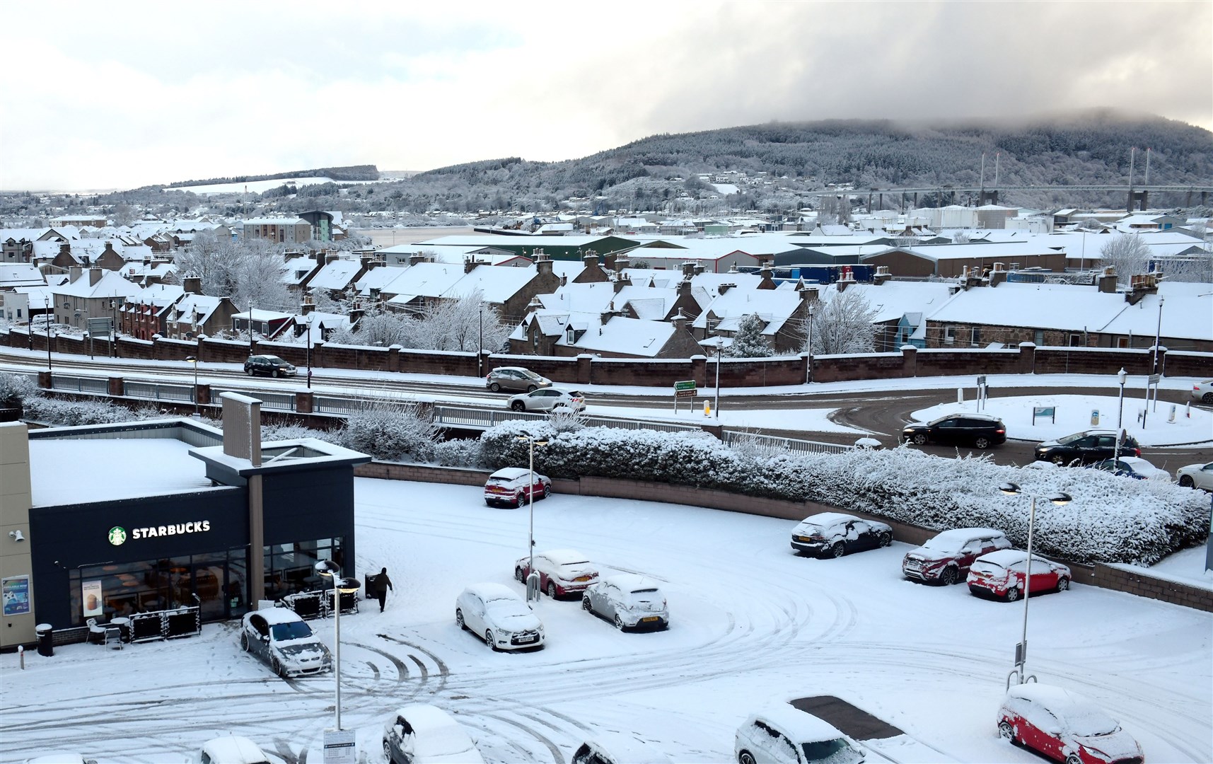 Snow seen from Inverness's Rose Street car park. Picture: James Mackenzie