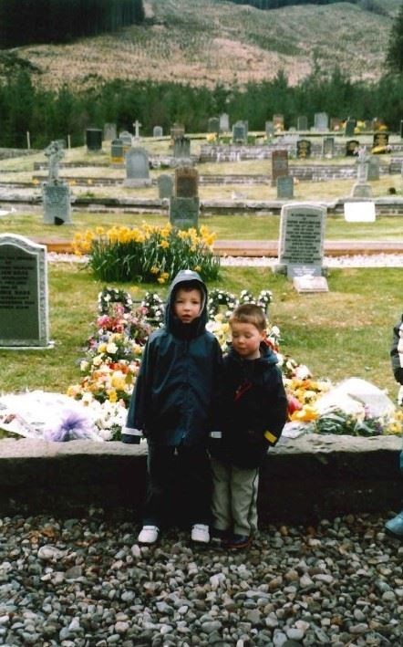 Andrew and his brother at Alastair's graveside