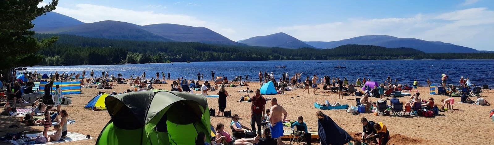 A busy beach at Loch Morlich last July.