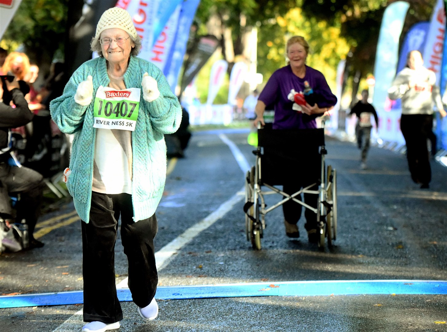 Kathleen Hagler, with friend Carolyn Doyle in the background, took part in a wheelchair tilt at a shorter Loch Ness Marathon road race to celebrate her 80th birthday, describing it as "one of the best things I've ever done". Picture: James Mackenzie.