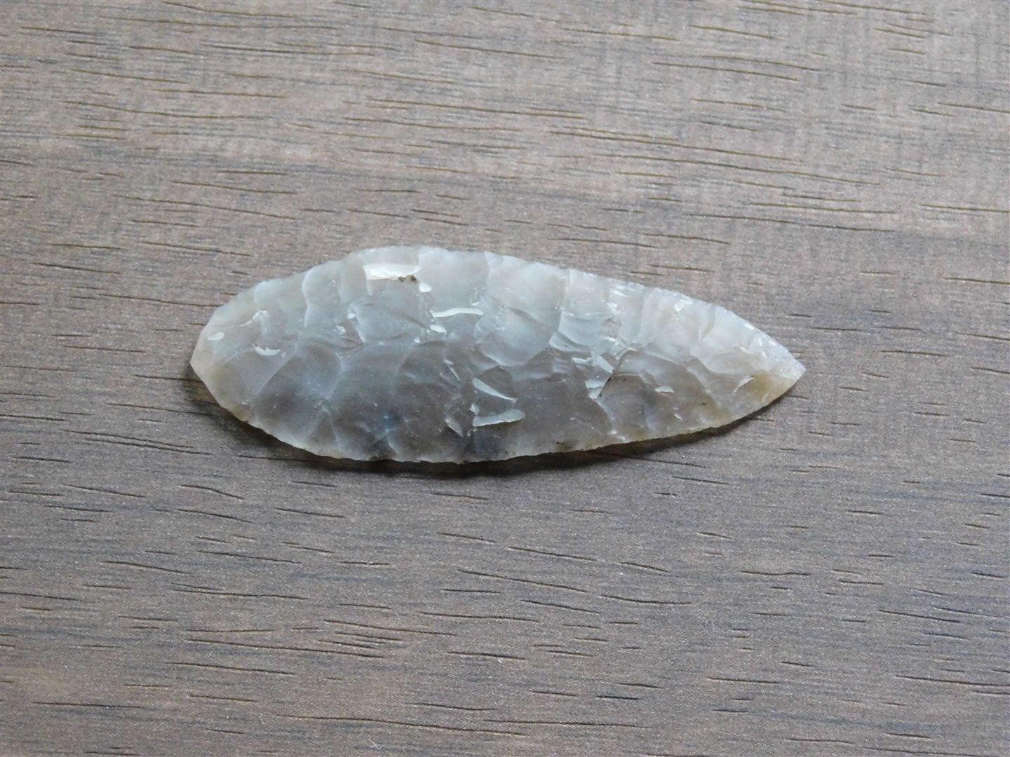 The rare Neolithic arrowhead found by Dr Pete Cosgrove will go on museum display.