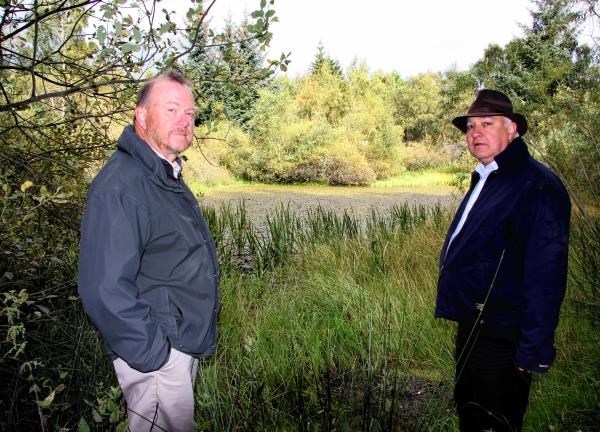 Mr John Grierson, chairman of Aviemore Community Council, and vice-chair Bill Lobban by the lochan