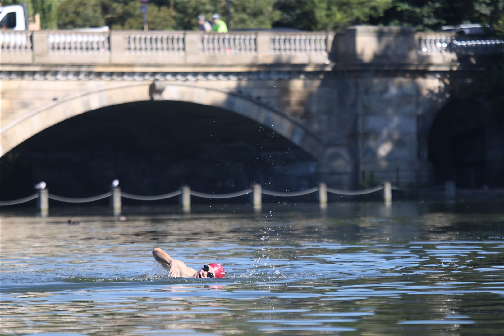 A man takes a morning swim in London’s Hyde Park (James Manning/PA)