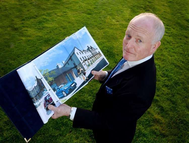 William Frame with an artist's impression of his planned Tomatin retail, food and hotel development.