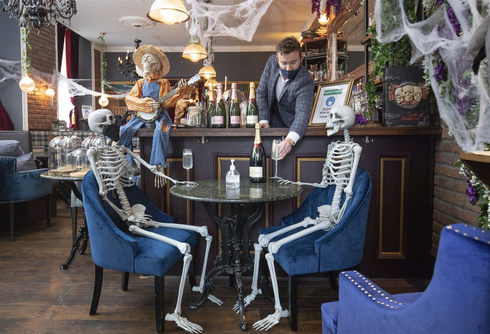 Chris Doherty, owner of Hemingway’s in Edinburgh, decorated his empty restaurant with skeletons in October as it remain closed during a coronavirus lockdown (Jane Barlow/PA)