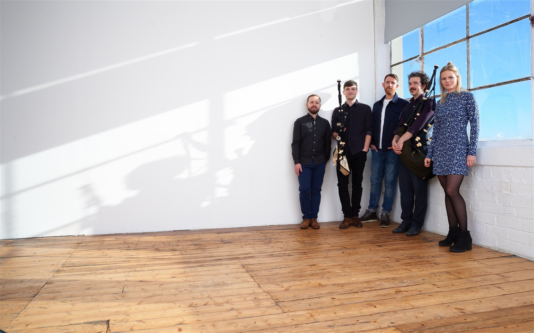 Ewan Robertson (centre) with his bandmates.